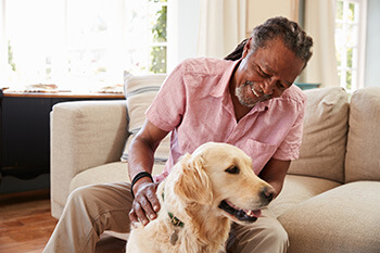 Older Man Petting a Dog